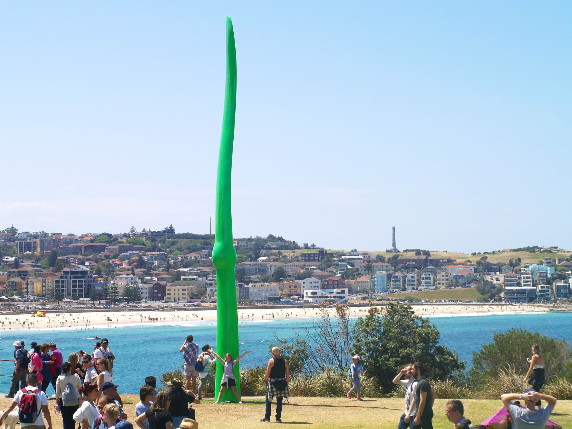 Green Life rising above visitors with Bondi beach behind