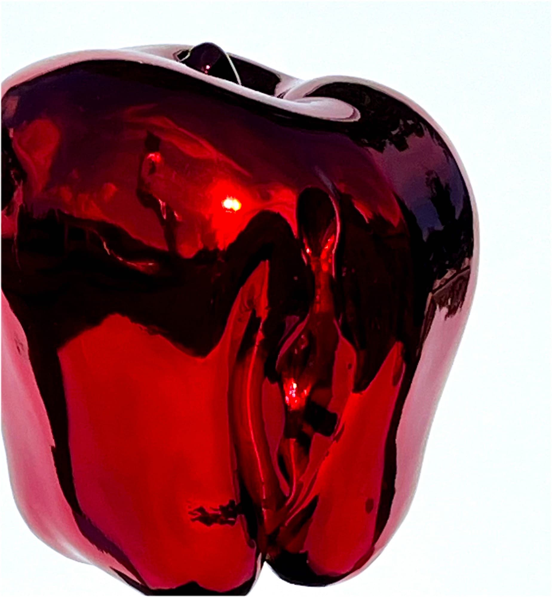 Jablko, close-up of the red mirror-polished surface