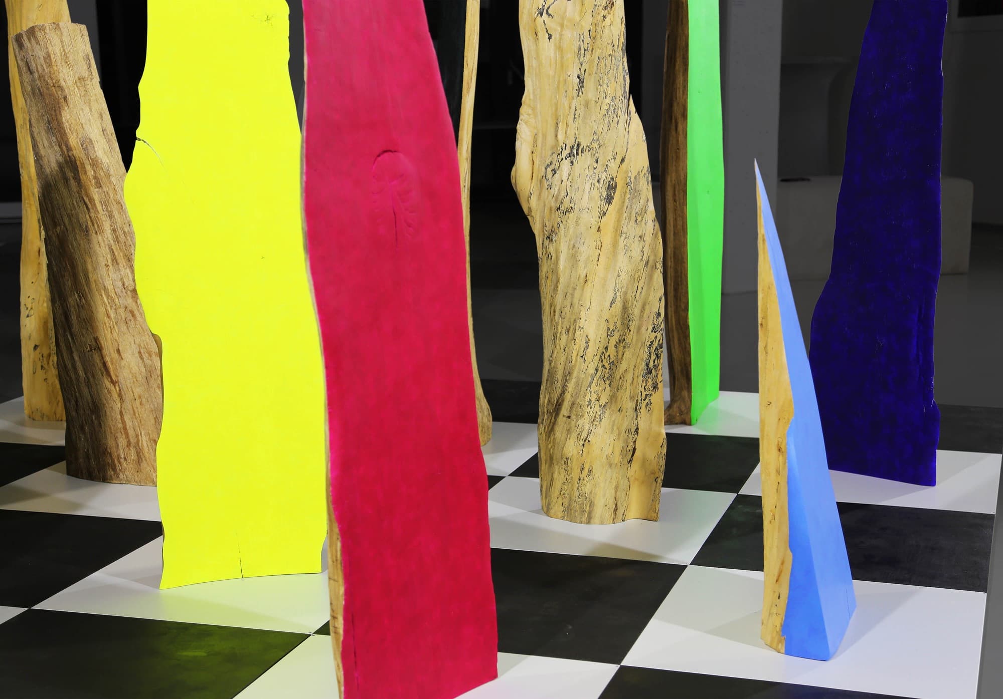 12, yellow, red and blue forms on the chequered floor, close view