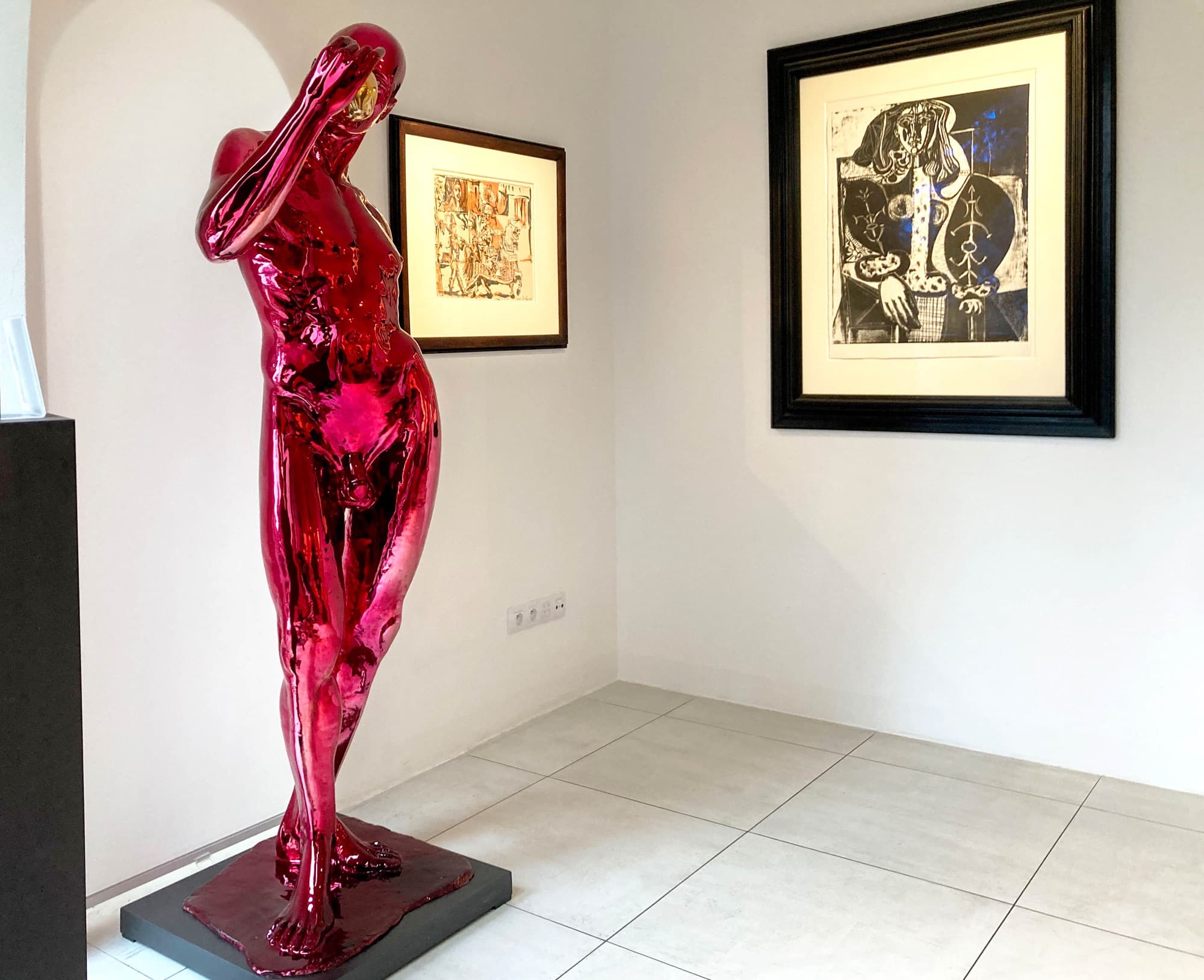 Adam – The Happy Prince displayed in an interior beside framed Picasso prints