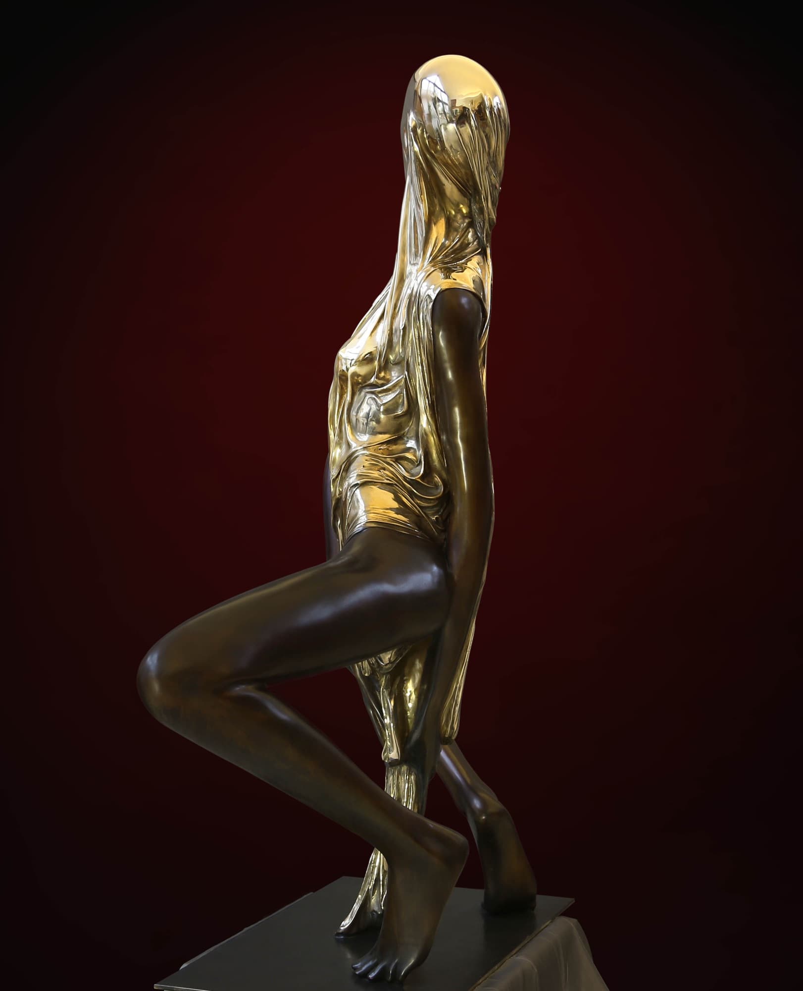 Lilith, side view against a dark red backdrop